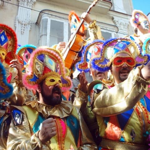 Group of men in costume singing on the Cadiz Carnival Day Trip